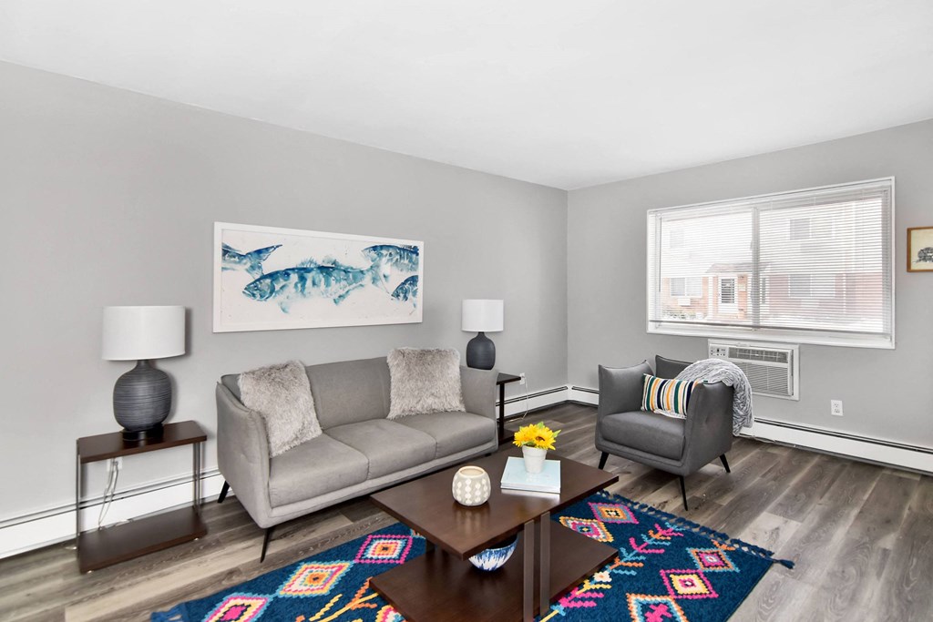 a living room with a couch and a coffee table at Encore 99, East Haven, Connecticut