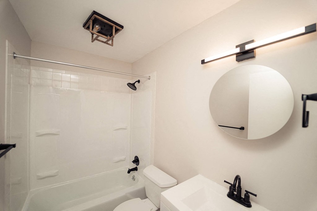 a bathroom with a shower and a sink and a mirror at Five High, West Hartford, 06119