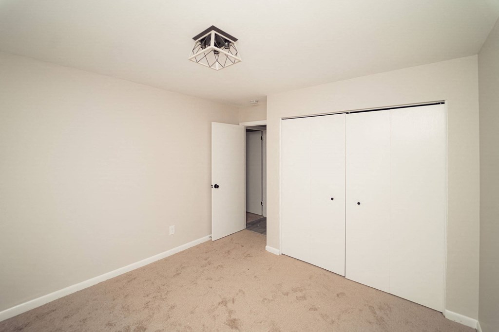 a bedroom with a closet and a door to a hallway at Five High, Connecticut