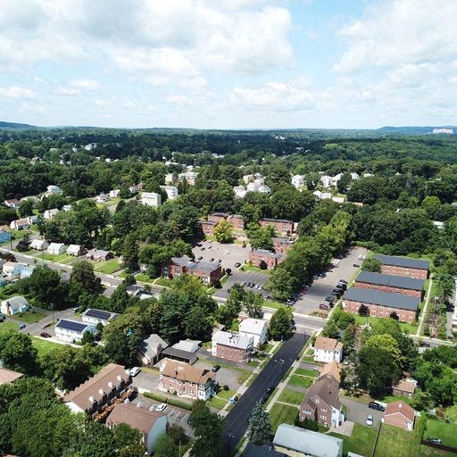 an aerial view of a neighborhood with houses and trees