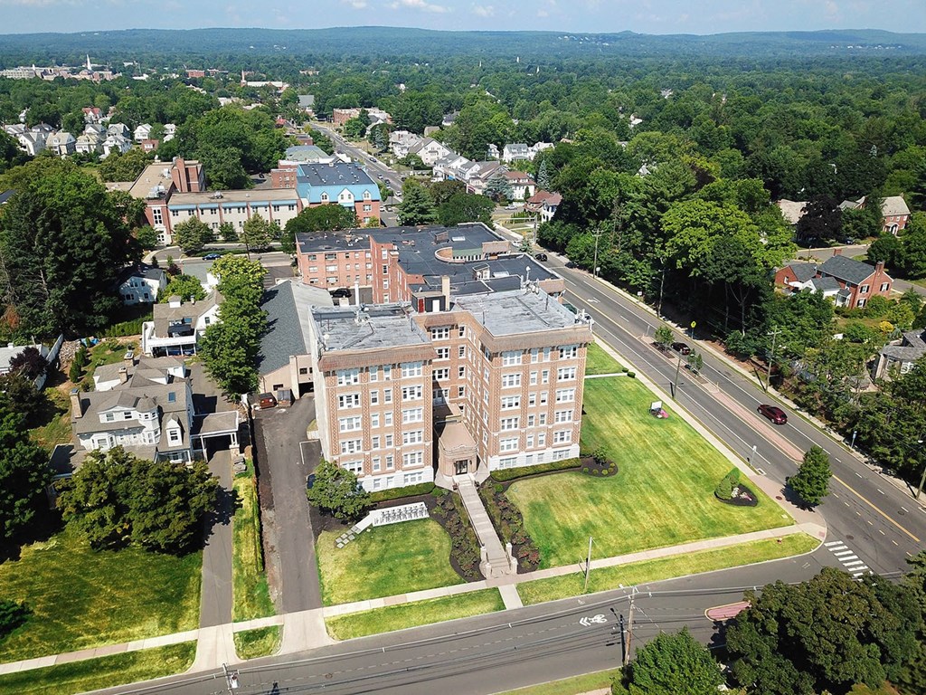 an aerial view of an apartment building in a city
