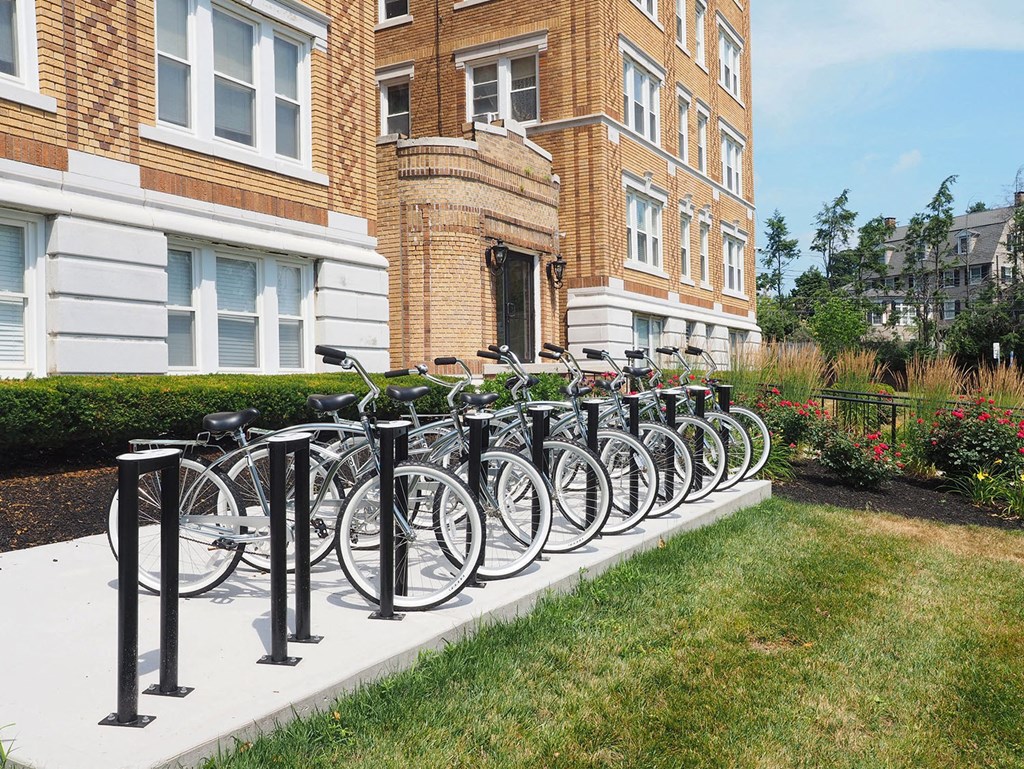 a row of bikes parked in front of a building