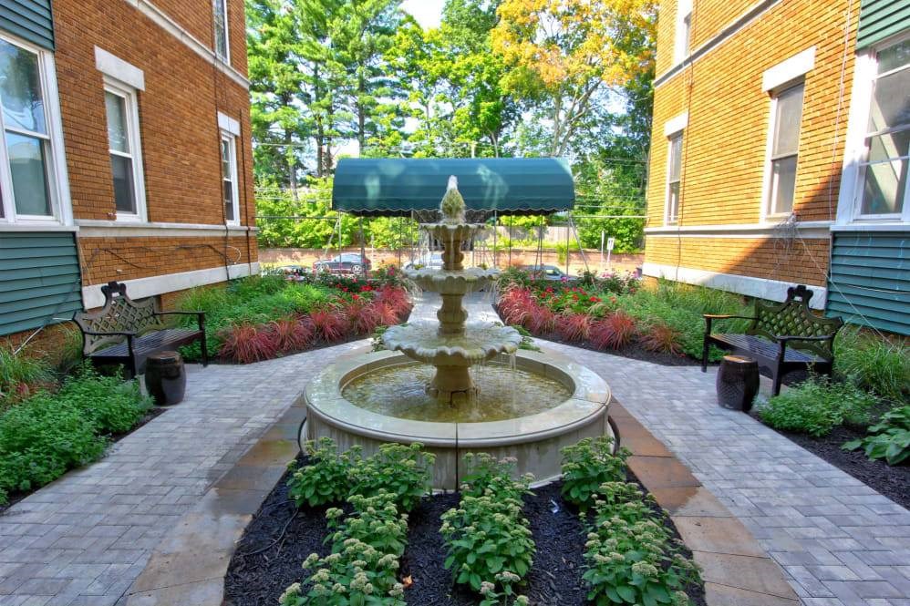 a fountain in the middle of a courtyard