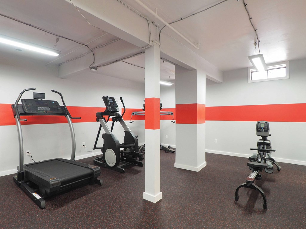 a gym with exercise equipment and a red stripe on the wall a gym with exercise equipment and a red stripe on the wall at The Packard, West Hartford, 06119