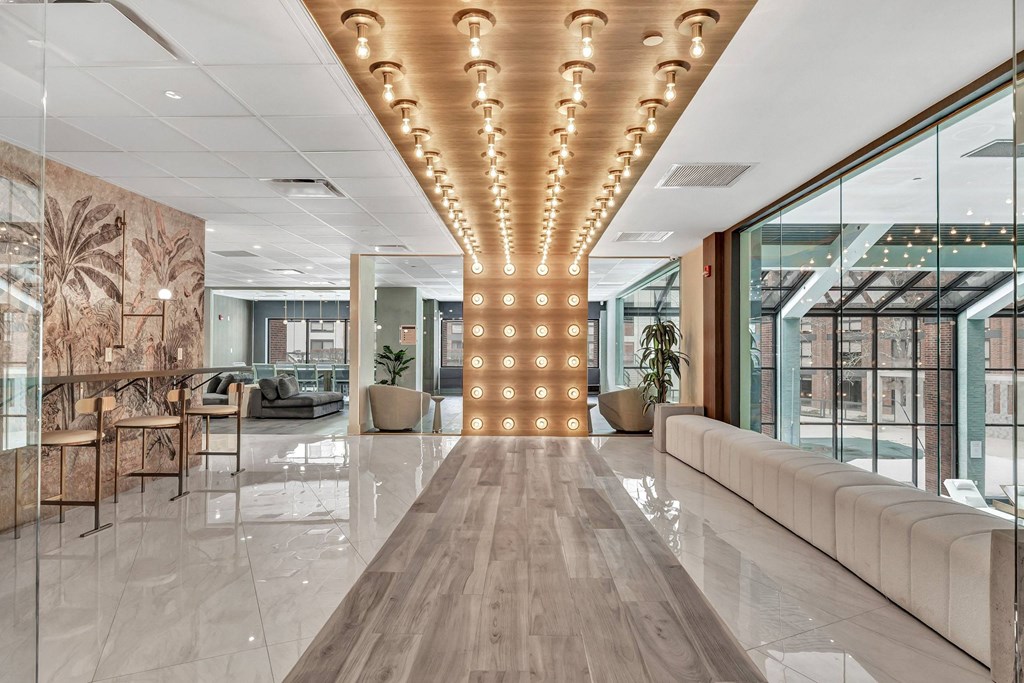 a large lobby with a row of lights on the ceiling