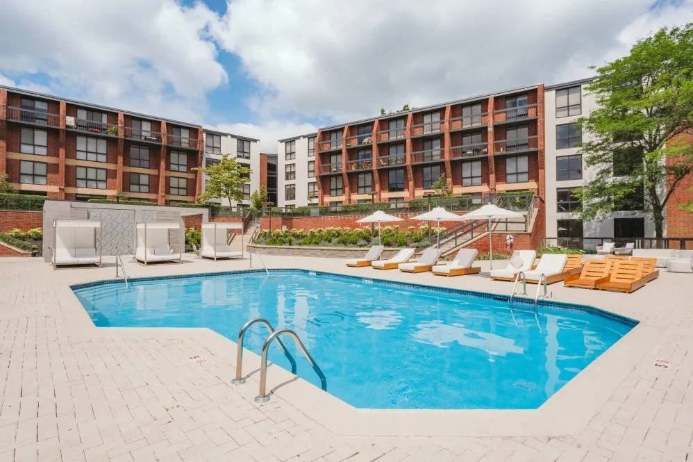 a swimming pool in front of a hotel
