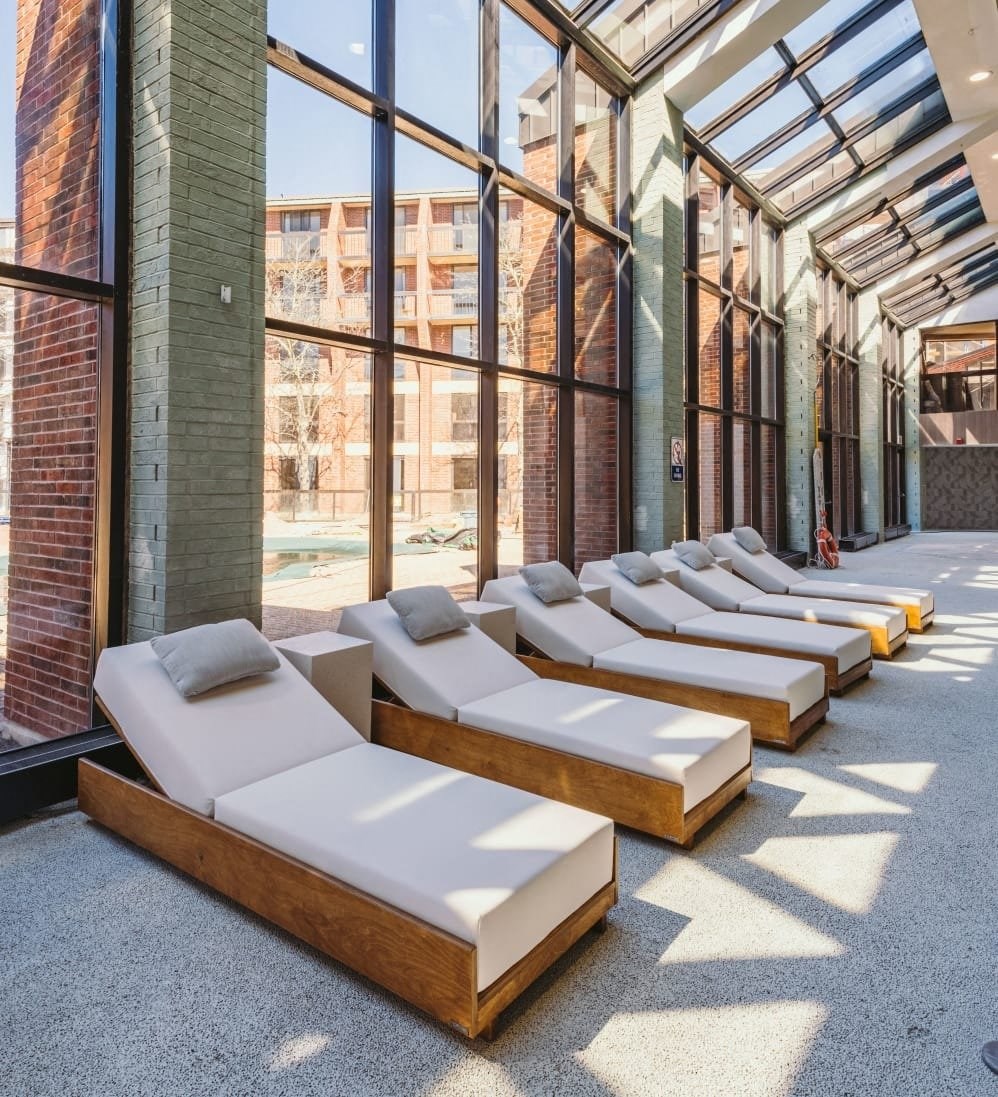 a row of beds in a lobby of a building