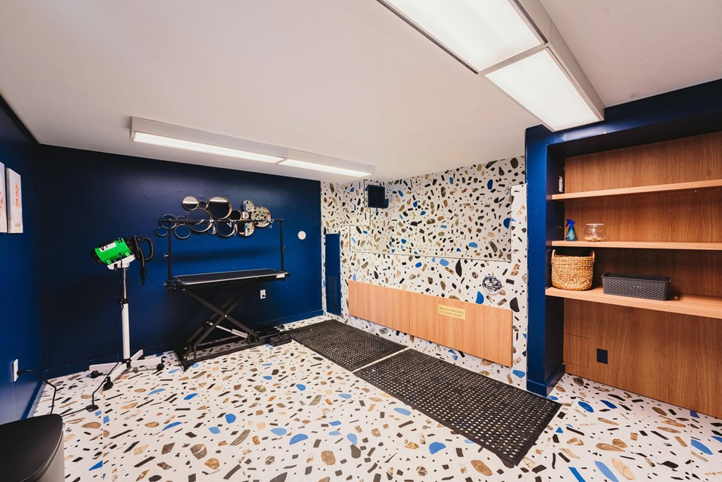 a recording studio with blue walls and a white and blue tile floor