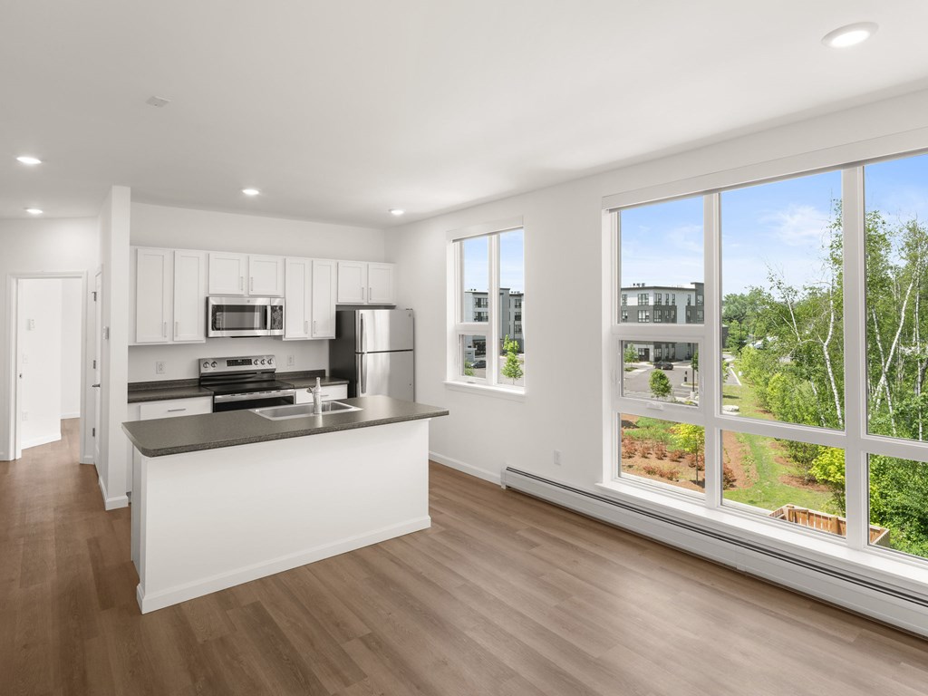 A modern kitchen with a large island in the middle.