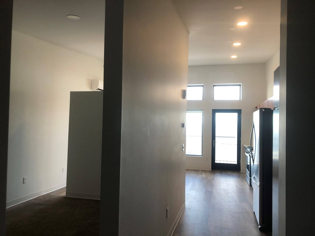 A room with a door and a window.