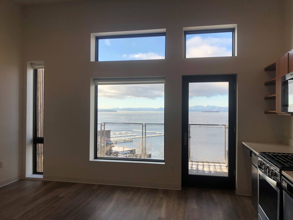 A kitchen with a view of the water.