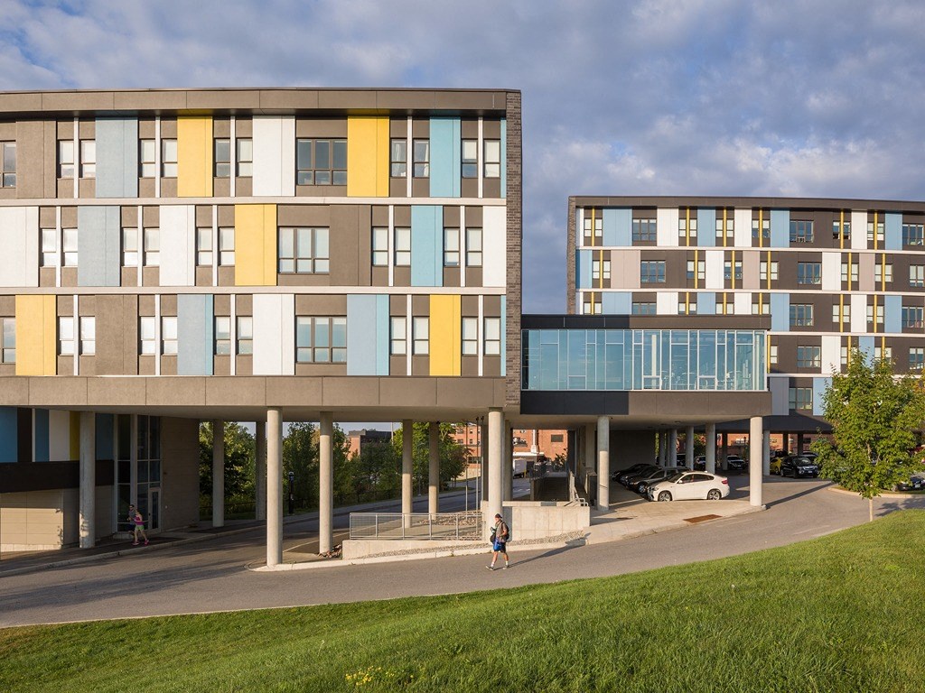 a rendering of two buildings with a street in front of them