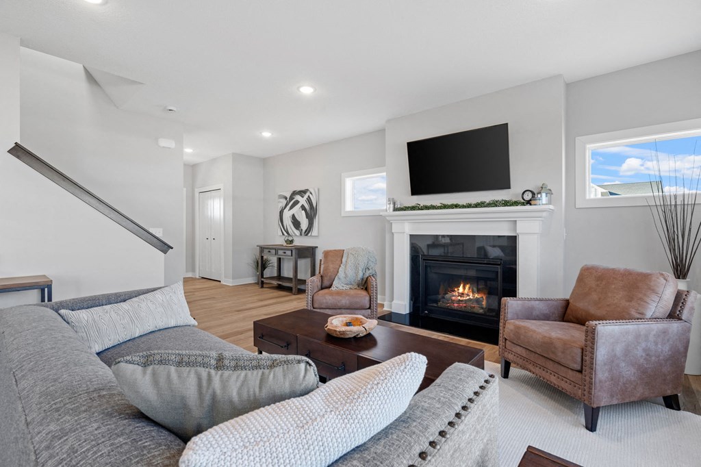 living room with fireplace and mounted tv