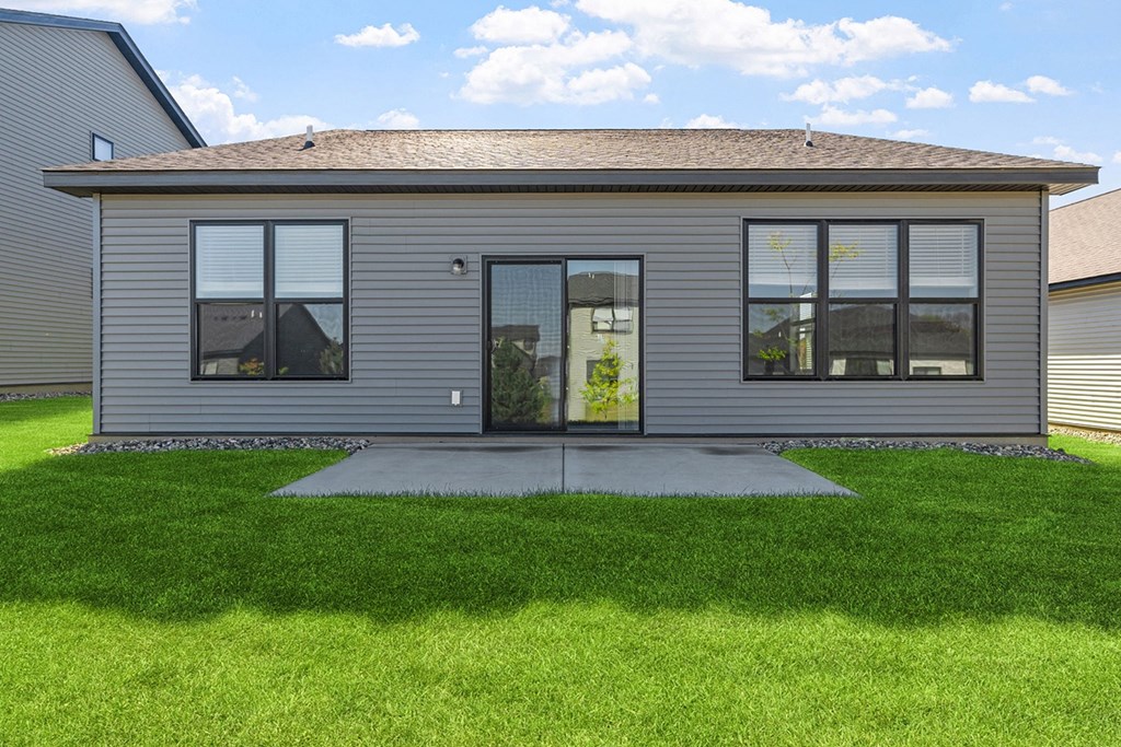 a home with a lawn in front of it