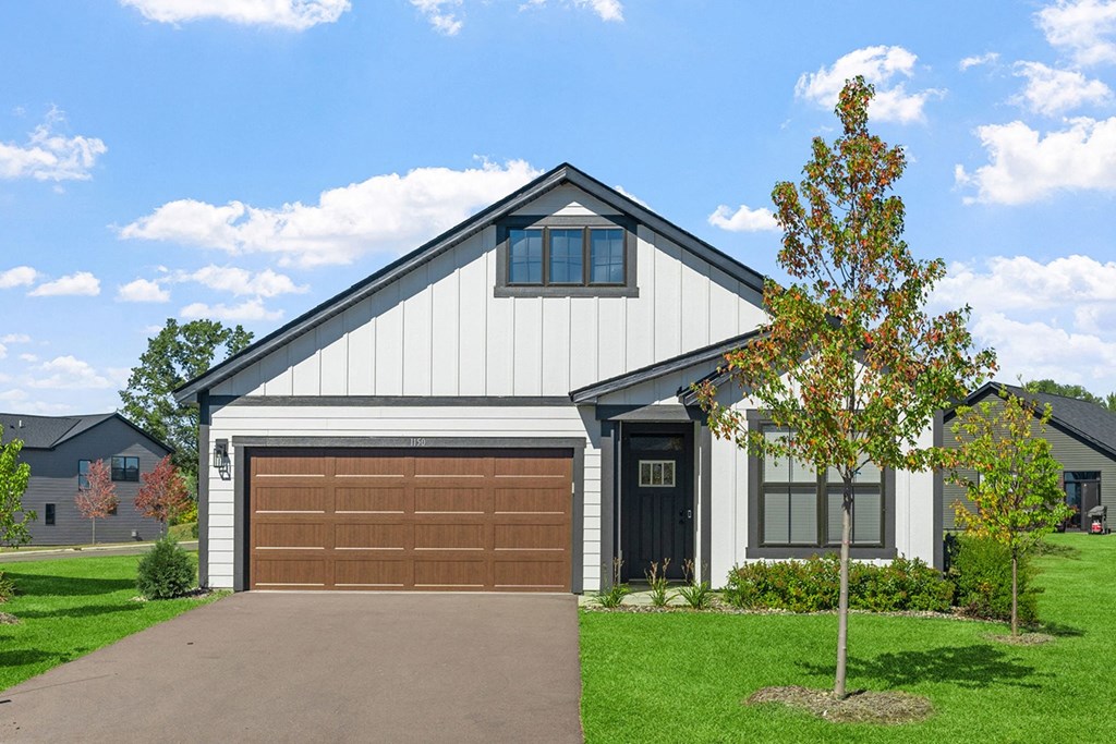 the front of a house with a garage door