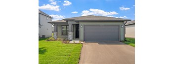a house with a driveway and a garage door