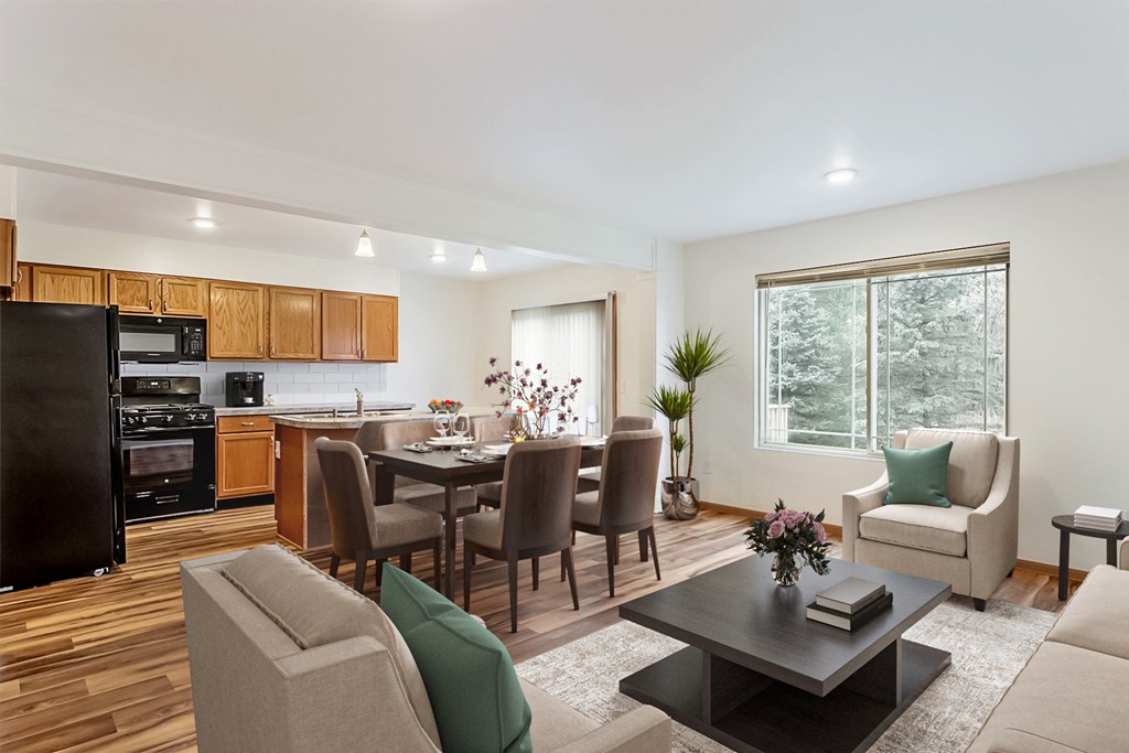 A modern kitchen with a dining table and chairs.