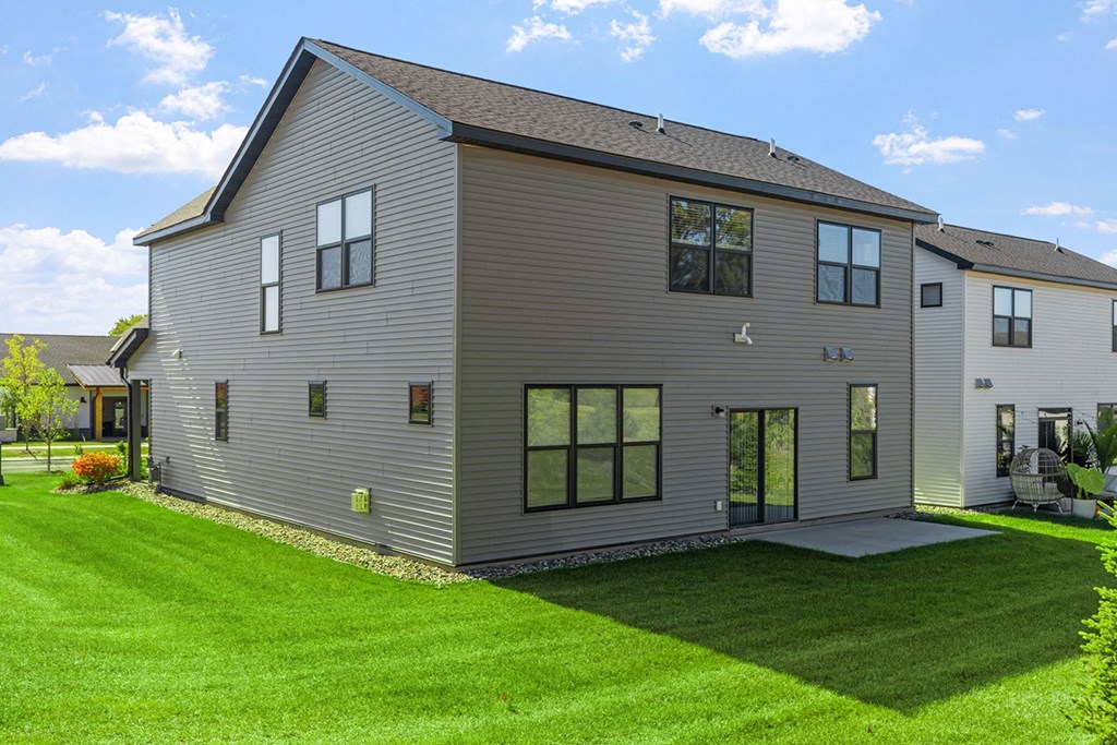 a large house with a yard in front of it