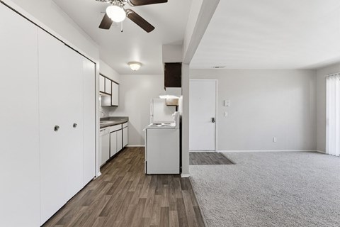 A white laundry room with a washer and dryer.