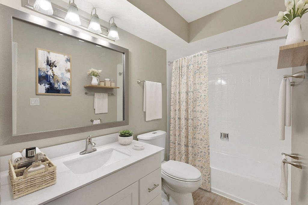 a bathroom with a sink toilet and a shower