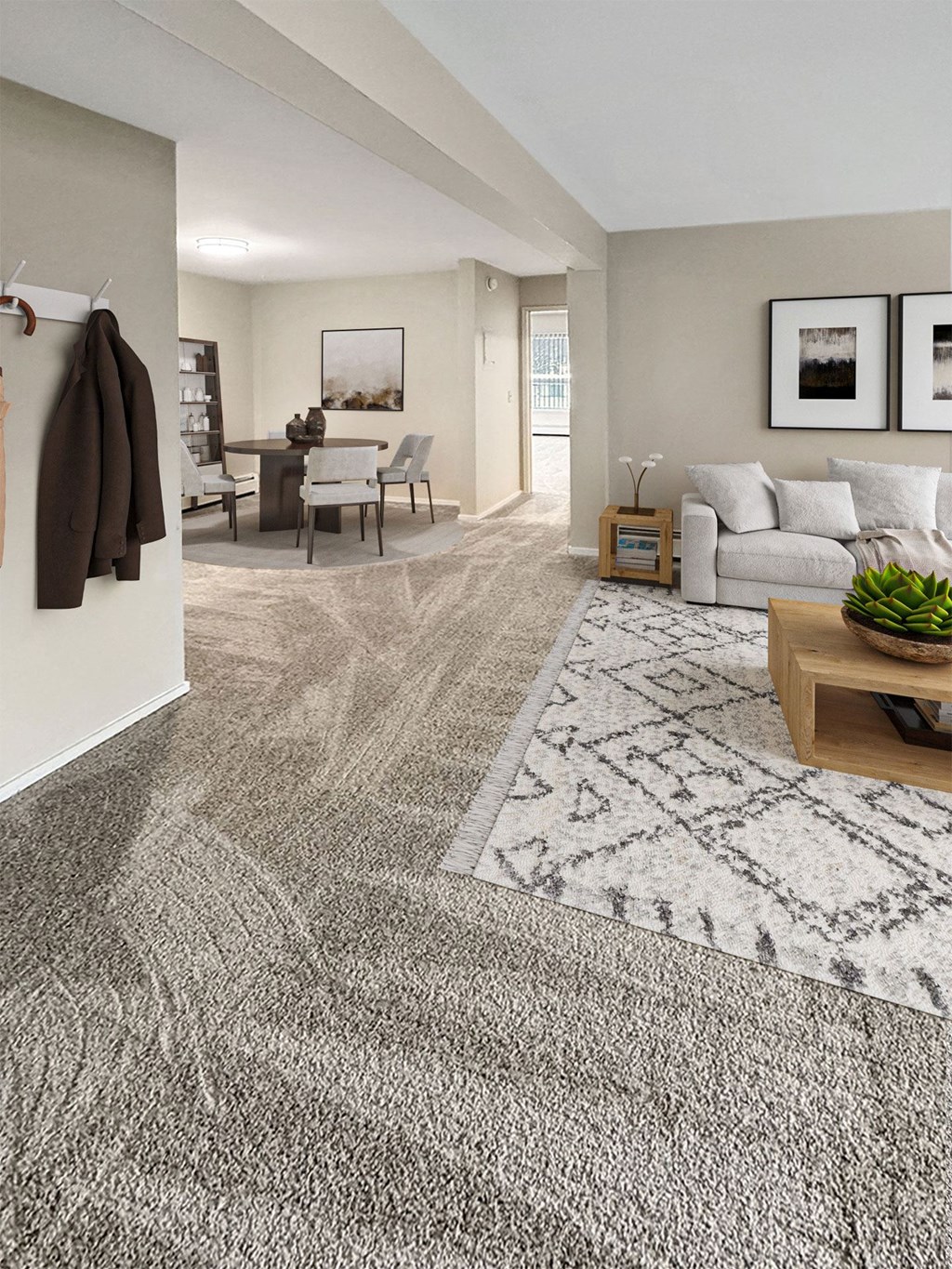 A living room with a grey rug and a brown jacket hanging on the wall.