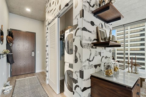 a hallway with a closet and a door to a bathroom