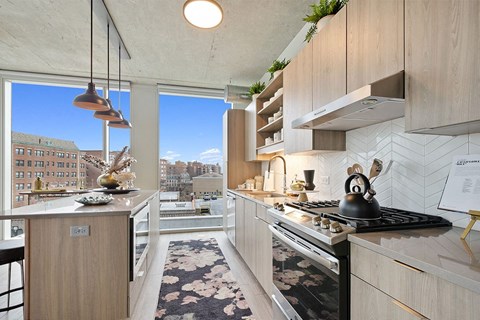 kitchen with light wood cabinets and stainless steel appliances