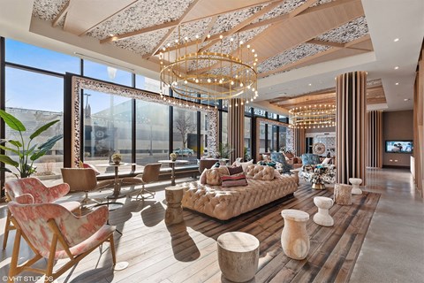 a rendering of a living room with large windows and a chandelier