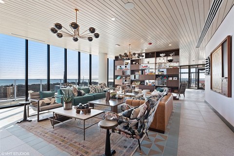 a living room filled with furniture and a large window