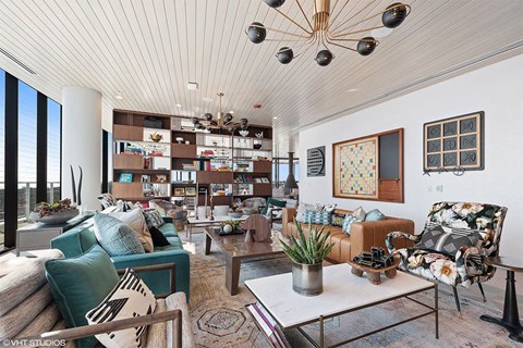 a living room filled with furniture and a large window