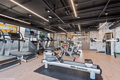 apartment fitness center with a variety of training equipment
