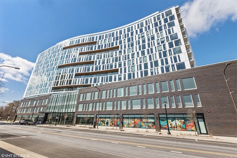 a large building on the corner of a city street