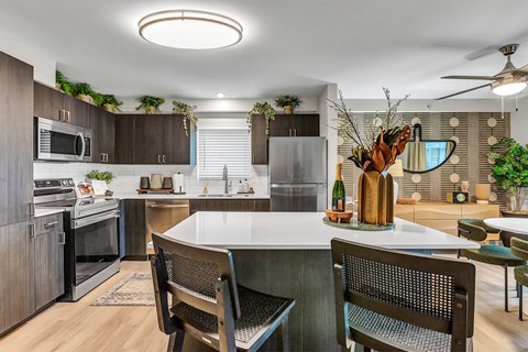 a kitchen with stainless steel appliances and a white counter top