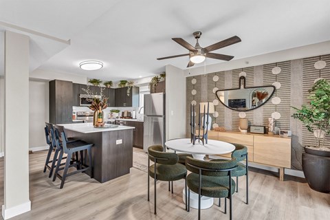 an open kitchen and dining room with a table and chairs