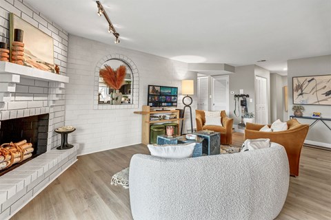 a living room with a couch and a fireplace