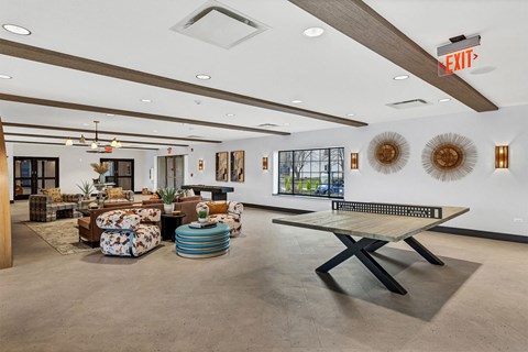 the preserve at ballantyne commons clubhouse with furniture and a ping pong table