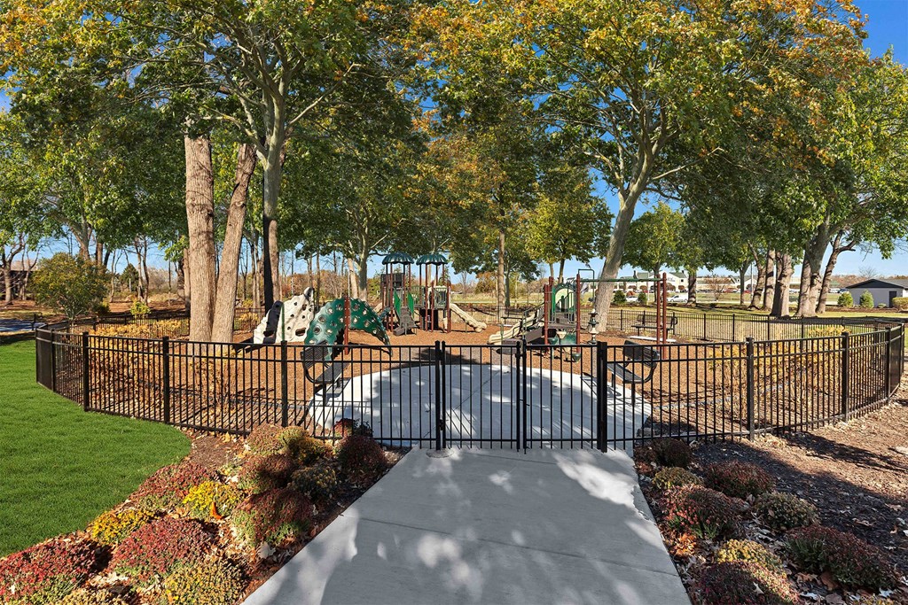 a view of a park with a playground and trees