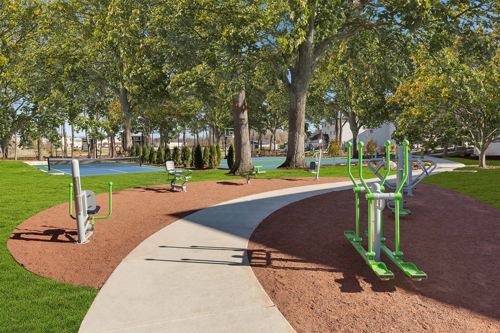 a park with playground equipment and trees