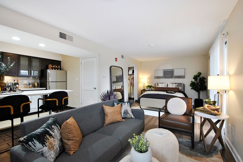 a living room with a couch and a bed