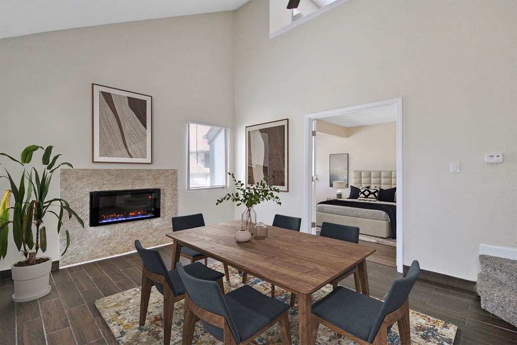 a dining room with a table and chairs and a fireplace