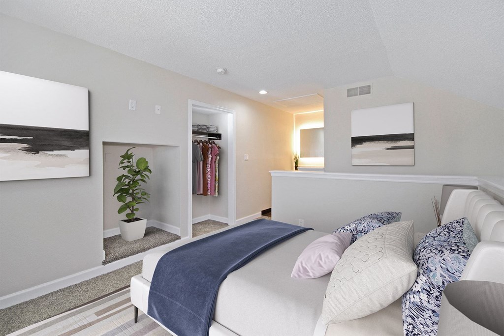 a bedroom with a bed and a closet