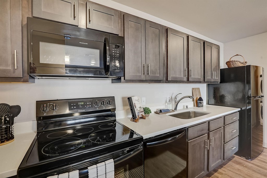 a kitchen with stainless steel appliances and a sink