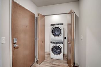 a small laundry room with a washing machine and a dryer