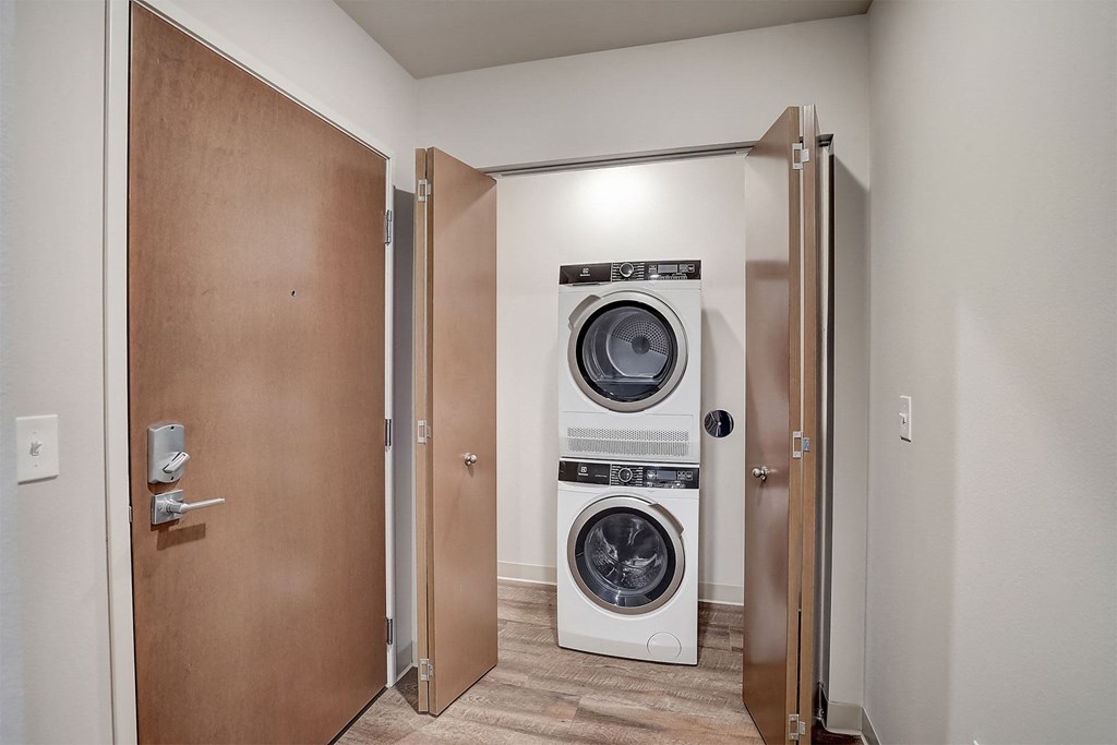 a small laundry room with a washing machine and a dryer