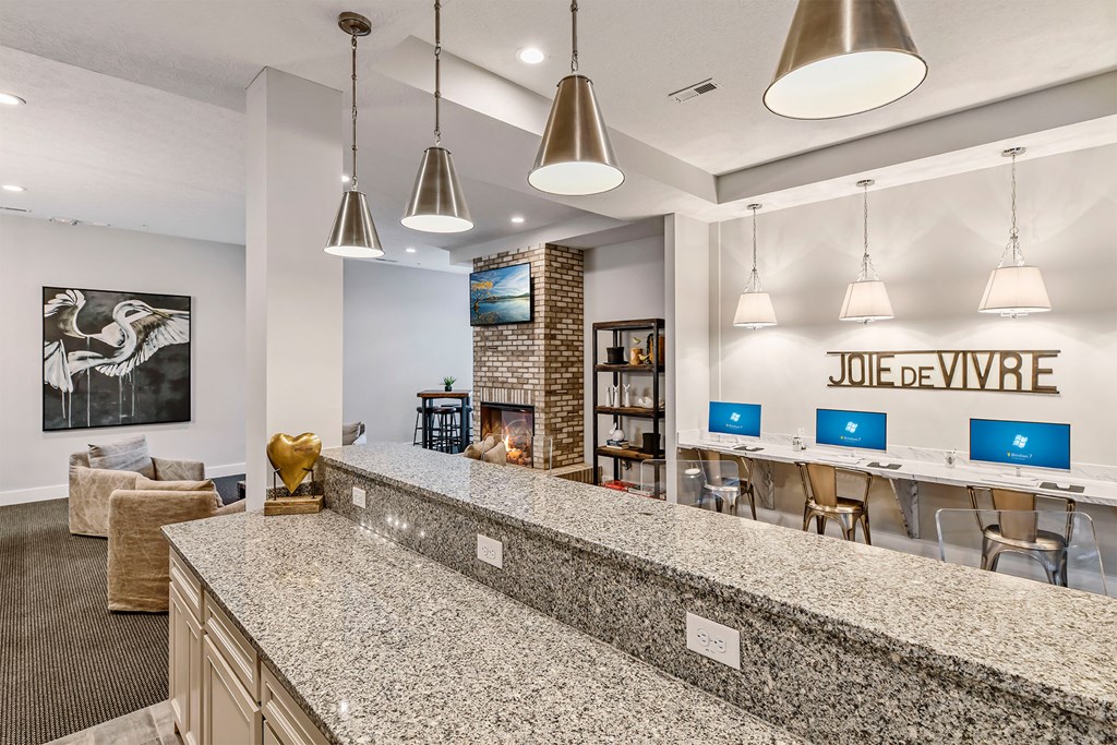 A reception area with a counter and chairs.
