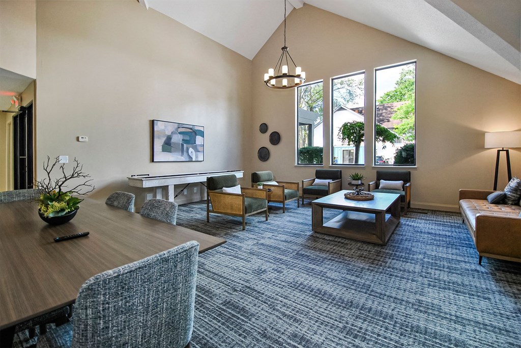 clubhouse lounge with furniture and a large window