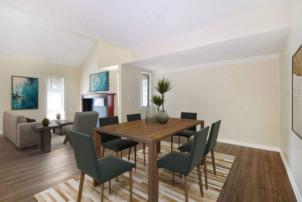 a dining room with a wooden table and chairs