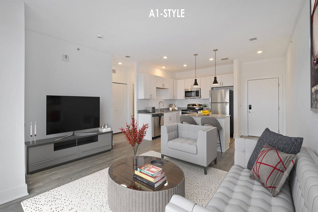 a white living room with a couch and a tv