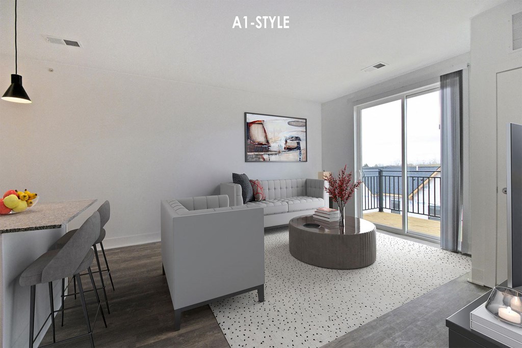 a living room with a couch and a table and a balcony