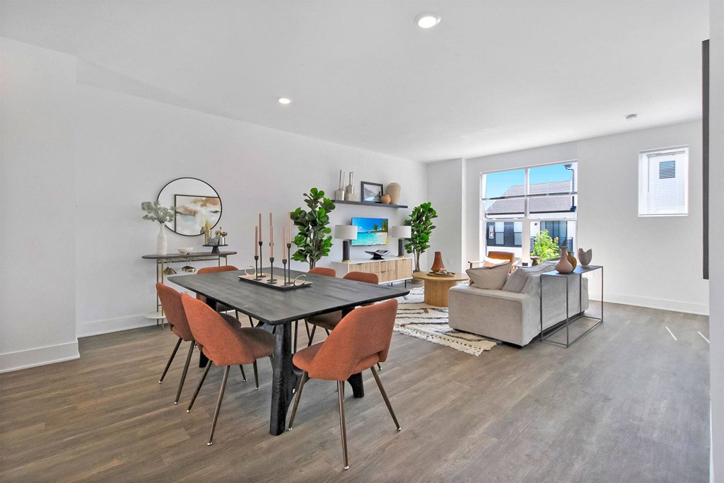 a living room with a dining room table and a couch